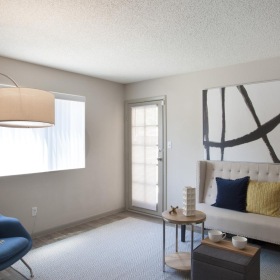 a room with seating and lamps